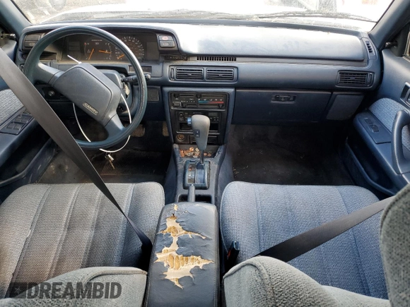 1990 Toyota Camry DLX z VIN 4T1SV21E8LU165609, wystawiony jako Copart lot #79314534 z przebiegiem 153 006 mil mil oraz Szkoda całkowita • Salvage title. Historia ofert i sprzedaży dostępna na DreamBid. Obrazek 8.