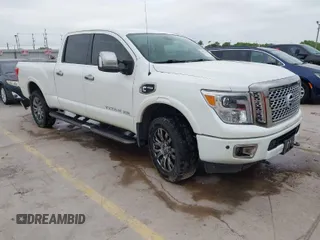 2017 Nissan Titan XD PRO-4X with VIN 1N6BA1F49HN559869, listed as a IAAI auction lot 39815796 with 143,617 mi miles. Bid and sale history available at carsss.com. Image 1.