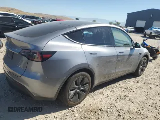 2024 Tesla Model Y Long Range with VIN 7SAYGDEE6RA321064, listed as a Copart auction lot 58889795 with 48,857 mi miles and Salvage title. Bid and sale history available at DreamBid. Image 3.