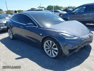 2018 Tesla Model 3 Long Range Battery with VIN 5YJ3E1EB1JF087098, listed as a IAAI auction lot 41737127 with 172,412 mi miles. Bid and sale history available at carsss.com. Image 1.