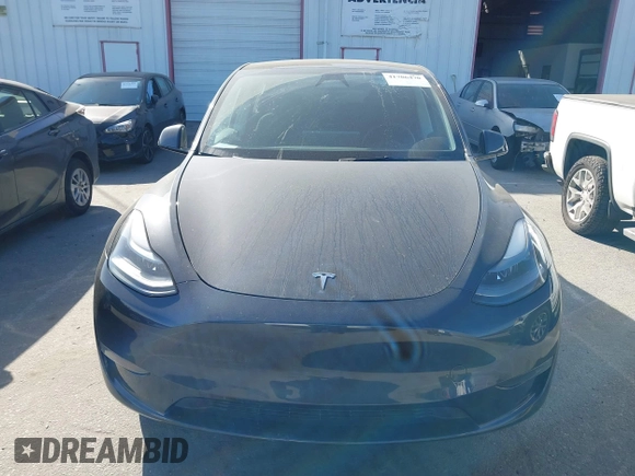 2025 Tesla Model Y Long Range with VIN 7SAYGDED2SF228414, listed as a IAAI auction lot 41706470 with 11,319 mi miles and . Bid and sale history available at DreamBid. Image 12.