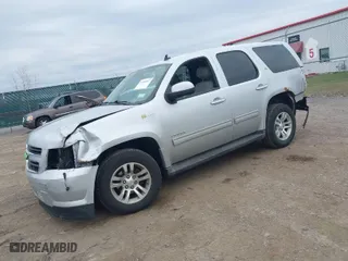 2012 Chevrolet Tahoe Hybrid with VIN 1GNSKDEJ9CR217355, listed as a IAAI auction lot 41901687 with 238,881 mi miles. Bid and sale history available at carsss.com. Image 2.