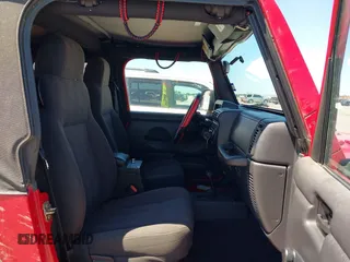 2005 Jeep Wrangler SE with VIN 1J4FA29S45P311320, listed as a IAAI auction lot 42095396 with 93,808 mi miles. Bid and sale history available at carsss.com. Image 5.