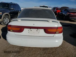 2001 Saturn SL z VIN 1G8ZK54771Z331414, wystawiony jako Copart lot #83895804 z przebiegiem 129 790 mil mil oraz Szkody całkowita. Historia ofert i sprzedaży dostępna na DreamBid. Obrazek 6.