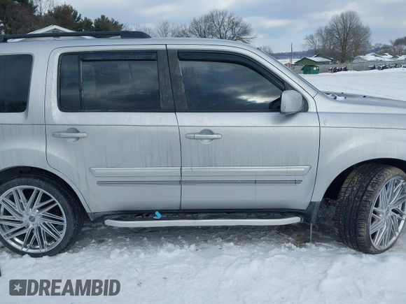 2011 Honda Pilot EX-L with VIN 5FNYF3H6XBB041672, listed as a IAAI auction lot 41337038 with 205,741 mi miles and . Bid and sale history available at DreamBid. Image 14.