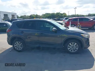 2015 Mazda CX-5 Touring with VIN JM3KE2CY9F0468199, listed as a IAAI auction lot 42099253 with 110,909 mi miles and . Bid and sale history available at carsss.com. Image 13.