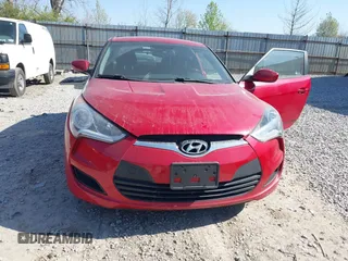 2014 Hyundai Veloster with VIN KMHTC6AD2EU214847, listed as a IAAI auction lot 42067728 with 77,421 mi miles. Bid and sale history available at carsss.com. Image 6.