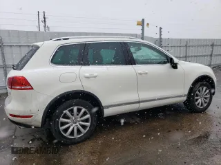 2011 Volkswagen Touareg Sport with VIN WVGFF9BP8BD002982, listed as a Copart auction lot 53958555 with 156,742 mi miles and Salvage Title. Bid and sale history available at DreamBid. Image 3.