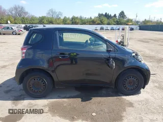 2012 Scion iQ with VIN JTNJJXB03CJ018302, listed as a IAAI auction lot 42000097 with 191,918 mi miles. Bid and sale history available at carsss.com. Image 14.