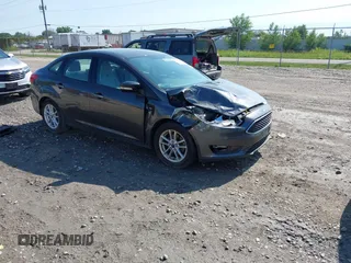 2015 Ford Focus SE z VIN 1FADP3F24FL280946, wystawiony jako IAAI lot #42640684 z przebiegiem 65 847 mil mil oraz . Historia ofert i sprzedaży dostępna na DreamBid. Obrazek 1.