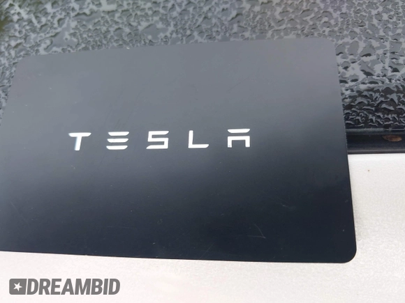 2021 Tesla Model 3 Long Range with VIN 5YJ3E1EB8MF974007, listed as a IAAI auction lot 41915513 with 107,354 mi miles and . Bid and sale history available at carsss.com. Image 11.