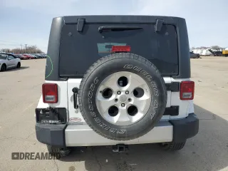 2015 Jeep Wrangler Unlimited Sahara with VIN 1C4BJWEG7FL768712, listed as a Copart auction lot 49963335 with 100,053 mi miles and Salvage Title. Bid and sale history available at carsss.com. Image 6.