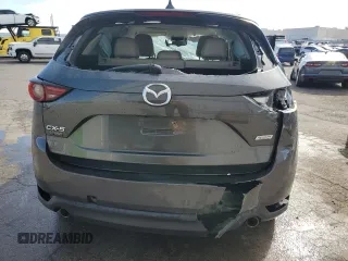 2018 Mazda CX-5 Grand Touring with VIN JM3KFADM1J1426938, listed as a Copart auction lot 50873615 with 83,436 mi miles and Clean Title. Bid and sale history available at carsss.com. Image 6.