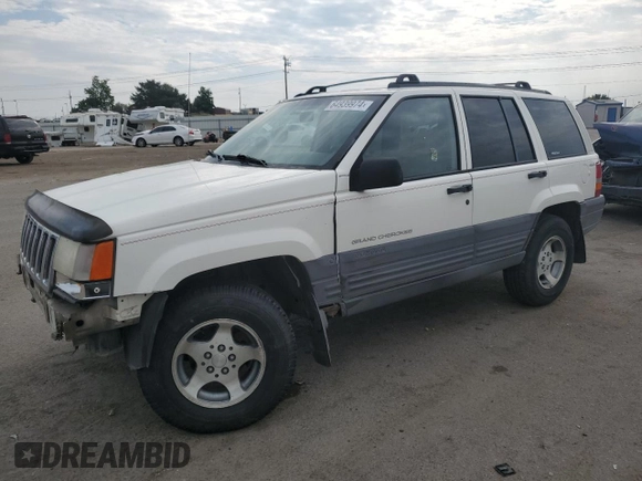 1997 Jeep Grand Cherokee Laredo with VIN 1J4GZ58S2VC676652, listed as a Copart auction lot 64939974 with 256,923 mi miles and Salvage Title. Bid and sale history available at carsss.com. Image 1.