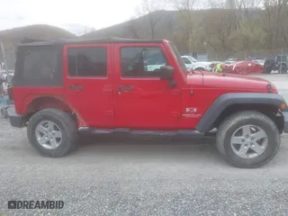 2008 Jeep Wrangler Unlimited X with VIN 1J8GA39128L562347, listed as a IAAI auction lot 41912669 with 106,040 mi miles. Bid and sale history available at carsss.com. Image 14.