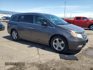2012 Honda Odyssey Touring with VIN 5FNRL5H90CB093963, listed as a Copart auction lot 55434725 with 202,867 mi miles and Salvage Title. Bid and sale history available at DreamBid. Image 4.