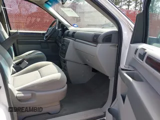 2006 Ford Freestar SEL z VIN 2FMZA52296BA23814, wystawiony jako IAAI lot #41791434 z przebiegiem 132 850 mil mil oraz . Historia ofert i sprzedaży dostępna na DreamBid. Obrazek 5.