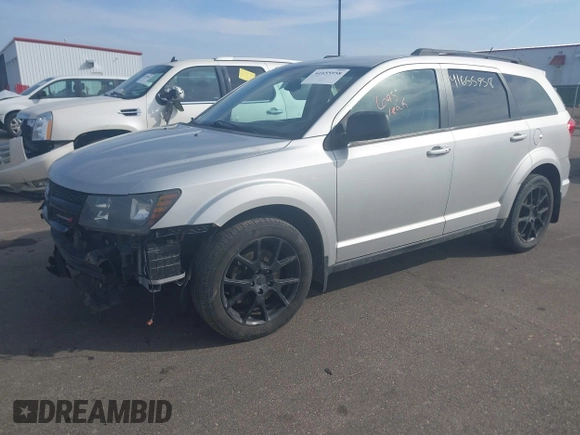 2013 Dodge Journey SXT with VIN 3C4PDDBG9DT680798, listed as a IAAI auction lot 41655958 with 140,594 mi miles and . Bid and sale history available at DreamBid. Image 2.