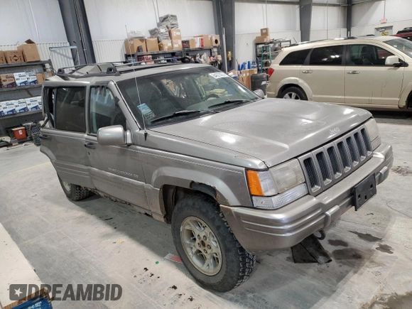 1997 Jeep Grand Cherokee Limited with VIN 1J4GZ78Y4VC589688, listed as a Copart auction lot 84673974 with 183,930 mi miles and Salvage Title. Bid and sale history available at carsss.com. Image 4.