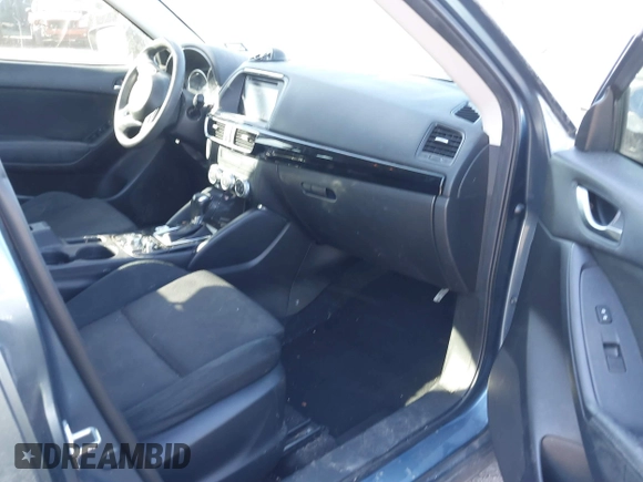 2016 Mazda CX-5 Sport with VIN JM3KE2BY3G0641895, listed as a IAAI auction lot 41689138 with 121,636 mi miles and . Bid and sale history available at DreamBid. Image 5.
