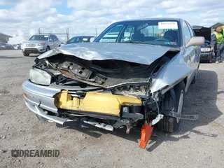 1992 Toyota Camry LE with VIN 4T1SK12E4NU141697, listed as a IAAI auction lot 41975478 with 100,732 mi miles. Bid and sale history available at carsss.com. Image 6.