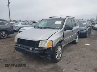2004 GMC Envoy SLE with VIN 1GKDT13SX42135951, listed as a IAAI auction lot 41668252 with 216,193 mi miles. Bid and sale history available at carsss.com. Image 6.