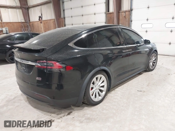 2019 Tesla Model X P90D with VIN 5YJXCAE4XKF180356, listed as a IAAI auction lot 42087926 with 79,041 mi miles. Bid and sale history available at carsss.com. Image 4.