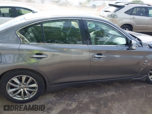 2015 Infiniti Q50 Premium z VIN JN1BV7AR1FM398047, wystawiony jako IAAI lot #42203862 z przebiegiem 104 002 mil mil oraz . Historia ofert i sprzedaży dostępna na DreamBid. Obrazek 13.