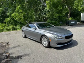 2012 BMW 6 Series 650i z VIN WBALZ3C55CDL70608, wystawiony jako Copart lot #59791605 z przebiegiem 97 077 mil mil oraz Tytuł czysty. Historia ofert i sprzedaży dostępna na DreamBid. Obrazek 1.