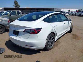 2023 Tesla Model 3 with VIN 5YJ3E1EA2PF571569, listed as a IAAI auction lot 42288715 with 30,271 mi miles and . Bid and sale history available at DreamBid. Image 4.