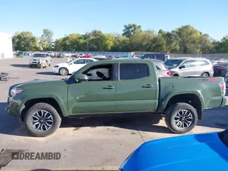2021 Toyota Tacoma SR with VIN 3TYCZ5AN2MT039450, listed as a IAAI auction lot 40457613 with 54,176 mi miles and . Bid and sale history available at DreamBid. Image 14.