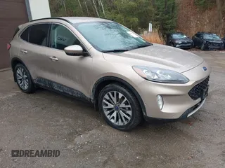 2021 Ford Escape Titanium Hybrid with VIN 1FMCU9DZXMUA66161, listed as a IAAI auction lot 41208651 with 61,198 mi miles and . Bid and sale history available at DreamBid. Image 1.