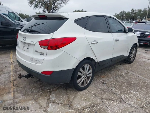 2013 Hyundai Tucson GLS with VIN KM8JU3AC8DU599937, listed as a IAAI auction lot 41398687 with 207,048 mi miles. Bid and sale history available at carsss.com. Image 4.