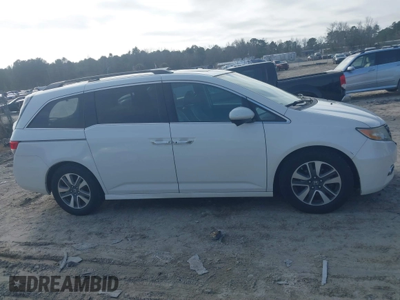 2014 Honda Odyssey Touring with VIN 5FNRL5H97EB127836, listed as a IAAI auction lot 41497413 with 174,914 mi miles and . Bid and sale history available at DreamBid. Image 13.