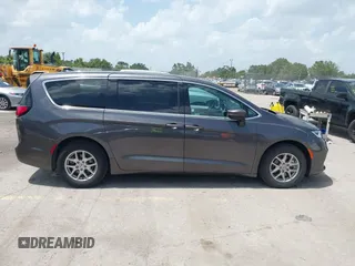 2023 Chrysler Pacifica Touring L with VIN 2C4RC1BG6PR590302, listed as a IAAI auction lot 42451369 with 72,097 mi miles and . Bid and sale history available at DreamBid. Image 13.