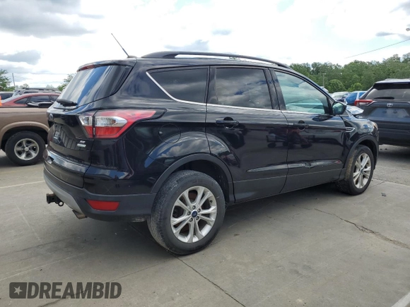 2017 Ford Escape SE z VIN 1FMCU0G93HUF10560, wystawiony jako Copart lot #57973915 z przebiegiem 127 444 mil mil oraz Czysty tytuł • Clean title. Historia ofert i sprzedaży dostępna na DreamBid. Obrazek 3.