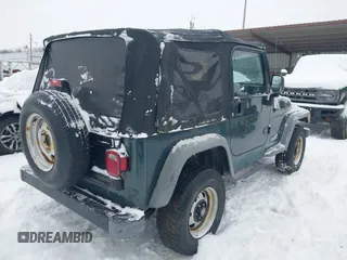 2004 Jeep Wrangler SE with VIN 1J4FA29154P778915, listed as a IAAI auction lot 41245325 with 205,852 mi miles and . Bid and sale history available at DreamBid. Image 4.