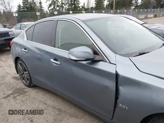 2017 Infiniti Q50 Premium z VIN JN1EV7AP1HM743432, wystawiony jako IAAI lot #41777874 z przebiegiem 94 354 mil mil oraz . Historia ofert i sprzedaży dostępna na DreamBid. Obrazek 13.
