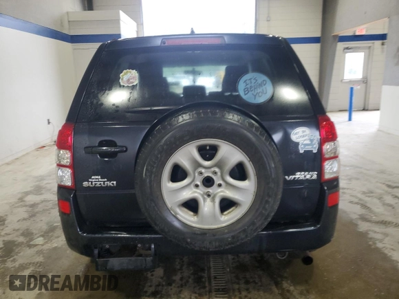 2009 Suzuki Grand Vitara with VIN JS3TE042694100010, listed as a Copart auction lot 56716225 with 148,495 mi miles and Salvage title. Bid and sale history available at DreamBid. Image 6.