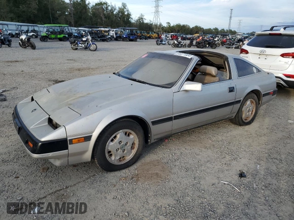 1984 Nissan 300ZX z VIN JN1HZ16S5EX016042, wystawiony jako Copart lot #86071904 z przebiegiem Nie podano mil oraz Szkoda całkowita • Salvage title. Historia ofert i sprzedaży dostępna na DreamBid. Obrazek 1.