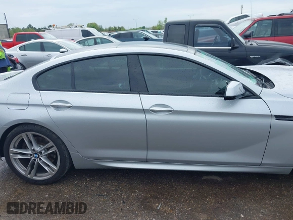 2015 BMW 6 Series 640i z VIN WBA6A0C51FD318982, wystawiony jako IAAI lot #41875547 z przebiegiem 60 968 mil mil oraz . Historia ofert i sprzedaży dostępna na DreamBid. Obrazek 13.