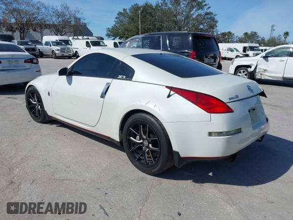 2004 Nissan 350Z Touring with VIN JN1AZ34E74T064156, listed as a IAAI auction lot 41498213 with 148,370 mi miles. Bid and sale history available at carsss.com. Image 3.