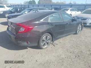 2016 Honda Civic EX-T z VIN 2HGFC1F3XGH630558, wystawiony jako IAAI lot #41868334 z przebiegiem 154 452 mil mil oraz . Historia ofert i sprzedaży dostępna na DreamBid. Obrazek 4.