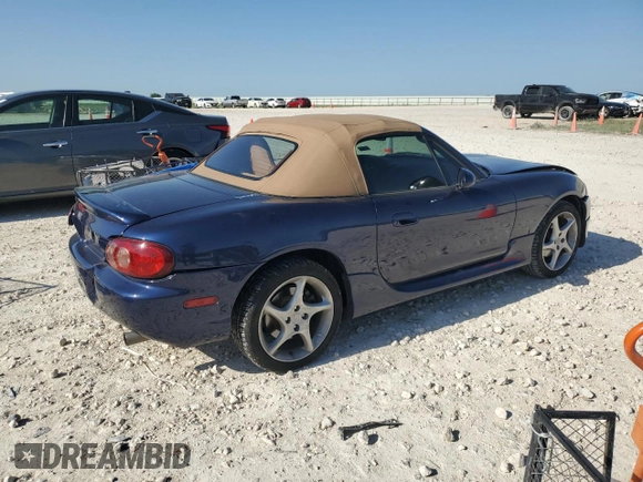 2002 Mazda MX-5 Miata Cloth z VIN JM1NB353720231873, wystawiony jako Copart lot #52398015 z przebiegiem 90 077 mil mil oraz Szkoda całkowita • Salvage title. Historia ofert i sprzedaży dostępna na DreamBid. Obrazek 3.