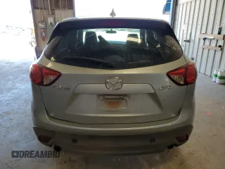 2016 Mazda CX-5 Touring with VIN JM3KE2CY0G0771566, listed as a Copart auction lot 52688255 with 142,204 mi miles and Salvage Title. Bid and sale history available at carsss.com. Image 6.