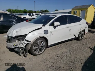 2018 Honda Clarity Touring z VIN JHMZC5F33JC002904, wystawiony jako Copart lot #55535325 z przebiegiem Nie podano mil oraz Szkoda całkowita • Salvage title. Historia ofert i sprzedaży dostępna na DreamBid. Obrazek 1.