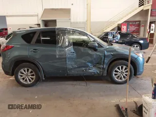 2016 Mazda CX-5 Touring z VIN JM3KE4CY2G0839202, wystawiony jako IAAI lot #41901207 z przebiegiem 65 449 mil mil oraz . Historia ofert i sprzedaży dostępna na DreamBid. Obrazek 14.