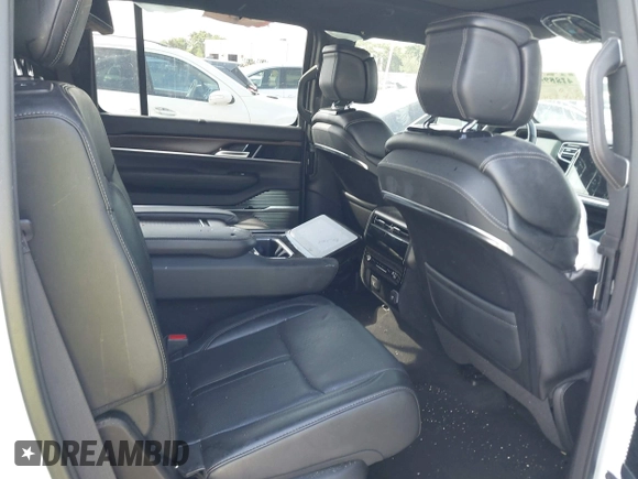 2023 Jeep Grand Wagoneer z VIN 1C4SJVEJ7PS570435, wystawiony jako IAAI lot #42289466 z przebiegiem Nie podano mil oraz . Historia ofert i sprzedaży dostępna na DreamBid. Obrazek 8.
