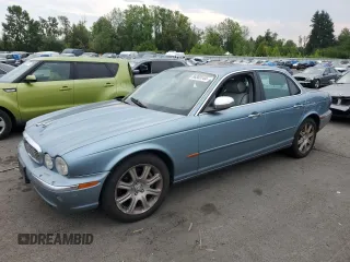 2004 Jaguar XJ Vanden Plas with VIN SAJWA74C24SG28080, listed as a Copart auction lot 66383144 with 210,783 mi miles and Clean Title. Bid and sale history available at DreamBid. Image 1.
