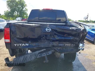 2013 Nissan Titan Pro-4X with VIN 1N6BA0EC4DN305032, listed as a IAAI auction lot 42341681 with 118,251 mi miles and . Bid and sale history available at DreamBid. Image 16.